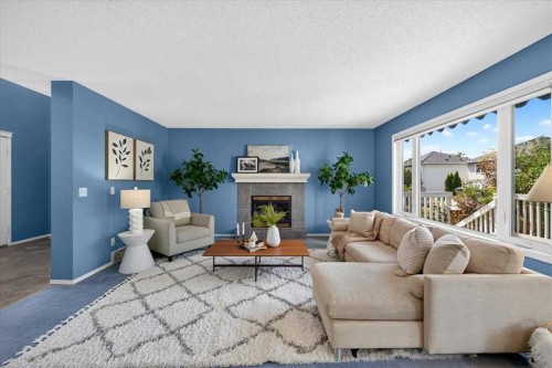 232 Douglas Glen Close Se, Calgary, AB - Indoor Photo Showing Living Room With Fireplace