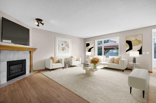 249 Scotia Point Nw, Calgary, AB - Indoor Photo Showing Living Room With Fireplace