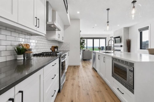220 Precedence View, Cochrane, AB - Indoor Photo Showing Kitchen With Upgraded Kitchen