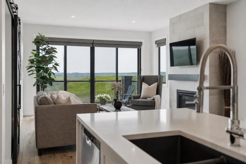 220 Precedence View, Cochrane, AB - Indoor Photo Showing Kitchen With Double Sink