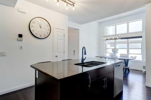 1058 New Brighton Park Se, Calgary, AB - Indoor Photo Showing Kitchen With Double Sink