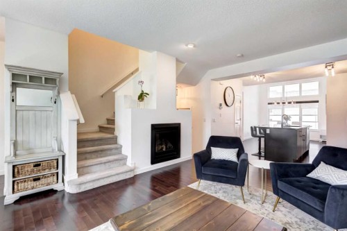 1058 New Brighton Park Se, Calgary, AB - Indoor Photo Showing Living Room With Fireplace