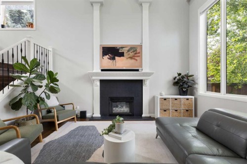 13 Somerset Park Sw, Calgary, AB - Indoor Photo Showing Living Room With Fireplace