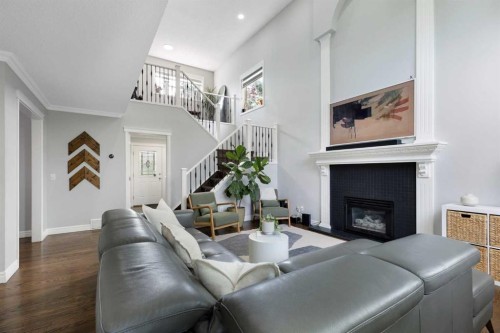 13 Somerset Park Sw, Calgary, AB - Indoor Photo Showing Living Room With Fireplace