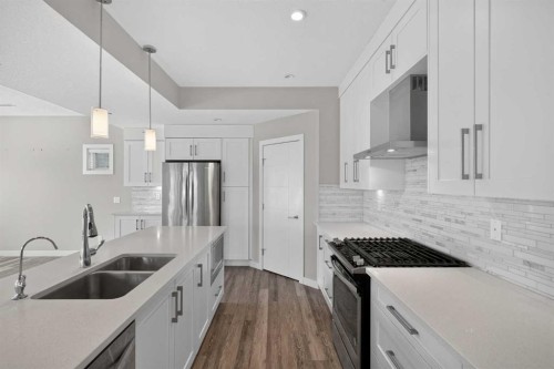 4-2416 30 Street Sw, Calgary, AB - Indoor Photo Showing Kitchen With Stainless Steel Kitchen With Double Sink With Upgraded Kitchen