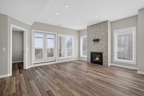 4-2416 30 Street Sw, Calgary, AB - Indoor Photo Showing Living Room With Fireplace