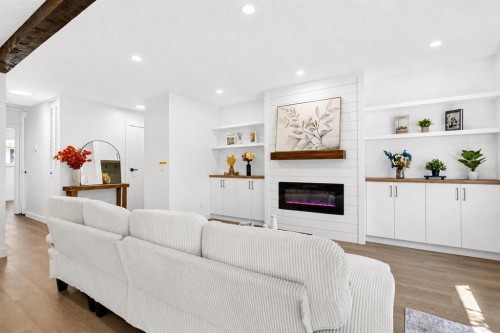 40-14736 Deerfield Drive Se, Calgary, AB - Indoor Photo Showing Living Room With Fireplace
