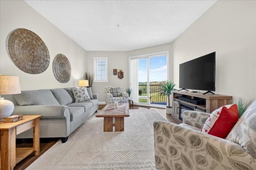 2305-15 Sunset Square, Cochrane, AB - Indoor Photo Showing Living Room