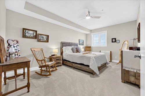 2305-15 Sunset Square, Cochrane, AB - Indoor Photo Showing Bedroom