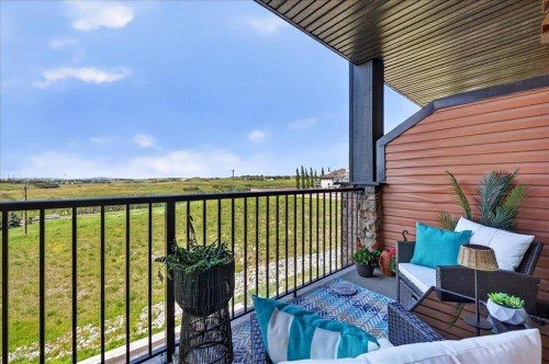 2305-15 Sunset Square, Cochrane, AB - Outdoor With Balcony With Exterior