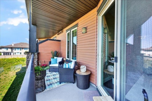 2305-15 Sunset Square, Cochrane, AB - Outdoor With Deck Patio Veranda With Exterior