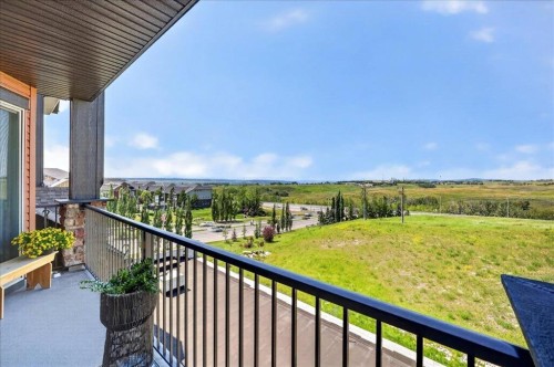 2305-15 Sunset Square, Cochrane, AB - Outdoor With Balcony With View With Exterior