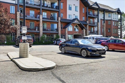 2305-15 Sunset Square, Cochrane, AB - Outdoor With Balcony With Facade