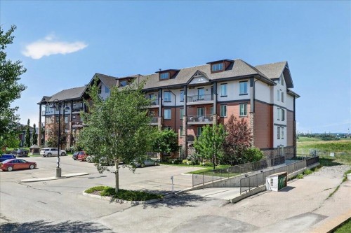 2305-15 Sunset Square, Cochrane, AB - Outdoor With Balcony