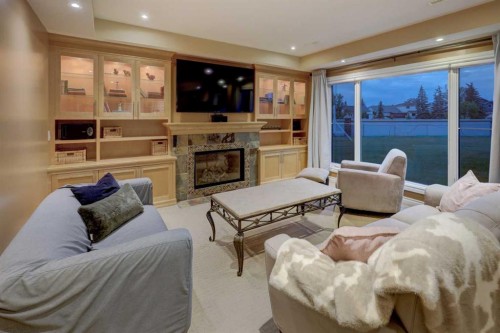 40 Arbour Estates Green Nw, Calgary, AB - Indoor Photo Showing Living Room With Fireplace