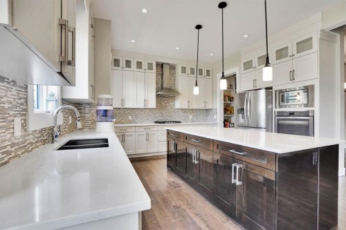 113 Kinniburgh Bay, Chestermere, AB - Indoor Photo Showing Kitchen With Double Sink With Upgraded Kitchen