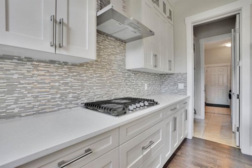 113 Kinniburgh Bay, Chestermere, AB - Indoor Photo Showing Kitchen With Upgraded Kitchen