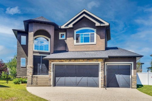 113 Kinniburgh Bay, Chestermere, AB - Outdoor With Facade