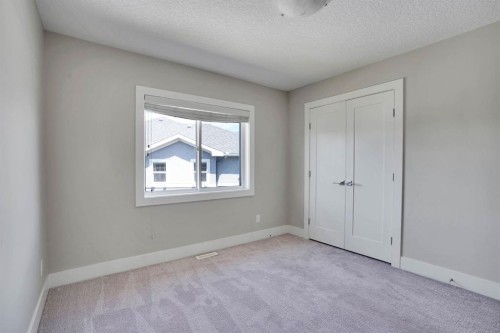 113 Kinniburgh Bay, Chestermere, AB - Indoor Photo Showing Other Room