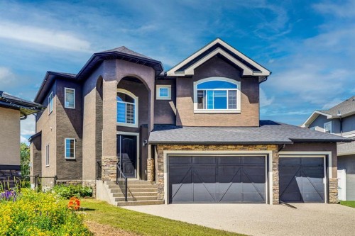 113 Kinniburgh Bay, Chestermere, AB - Outdoor With Facade