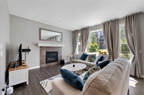 68 Nolanlake Point Nw, Calgary, AB - Indoor Photo Showing Living Room With Fireplace