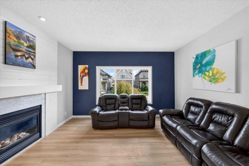 174 Mahogany Heights Se, Calgary, AB - Indoor Photo Showing Living Room With Fireplace