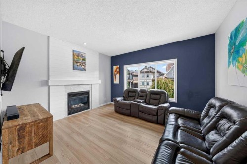 174 Mahogany Heights Se, Calgary, AB - Indoor Photo Showing Living Room With Fireplace