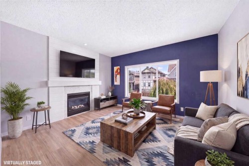 174 Mahogany Heights Se, Calgary, AB - Indoor Photo Showing Living Room With Fireplace