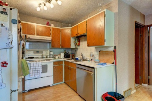 2009 41 Street Se, Calgary, AB - Indoor Photo Showing Kitchen With Double Sink
