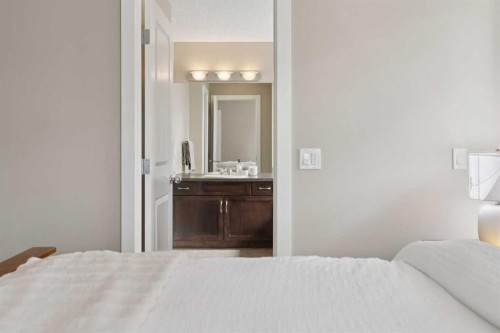 161 Heritage Bay, Cochrane, AB - Indoor Photo Showing Bedroom