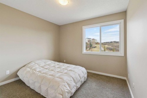 161 Heritage Bay, Cochrane, AB - Indoor Photo Showing Bedroom