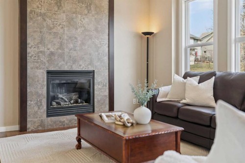 161 Heritage Bay, Cochrane, AB - Indoor Photo Showing Living Room With Fireplace