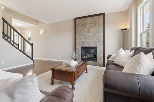 161 Heritage Bay, Cochrane, AB - Indoor Photo Showing Living Room With Fireplace