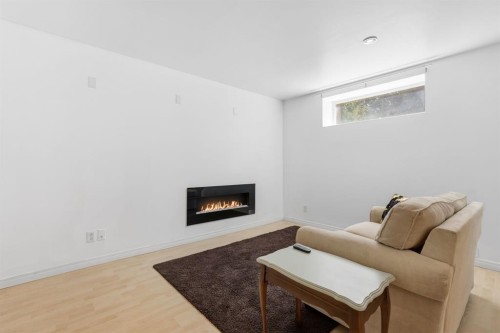 12 Valley Glen Heights Nw, Calgary, AB - Indoor Photo Showing Living Room With Fireplace