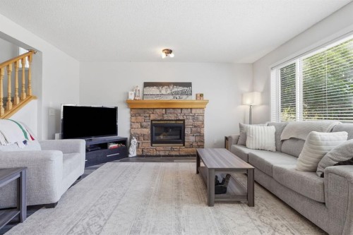 134 Prestwick Landing Se, Calgary, AB - Indoor Photo Showing Living Room With Fireplace