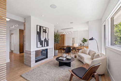 4935 10 Avenue Sw, Calgary, AB - Indoor Photo Showing Living Room With Fireplace