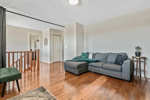 13 Dain Place Nw, Langdon, AB - Indoor Photo Showing Living Room