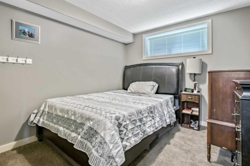 13 Dain Place Nw, Langdon, AB - Indoor Photo Showing Bedroom