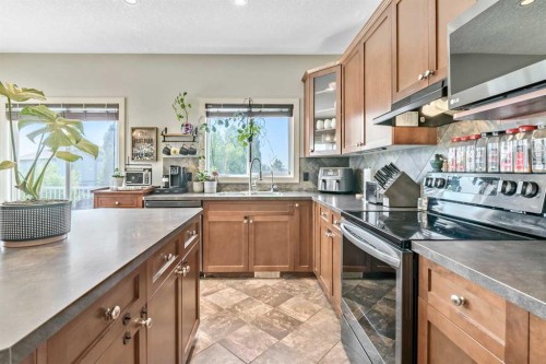 13 Dain Place Nw, Langdon, AB - Indoor Photo Showing Kitchen With Double Sink