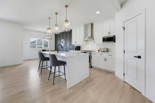 136 Sunrise Common, Cochrane, AB - Indoor Photo Showing Kitchen With Upgraded Kitchen