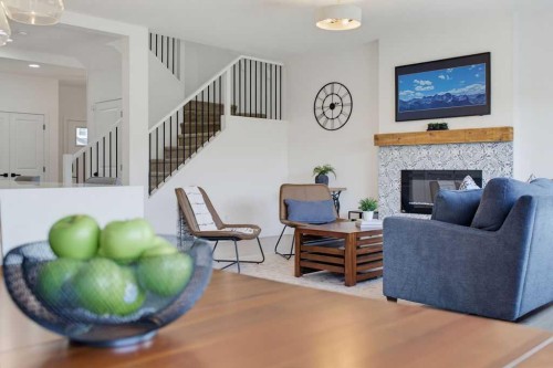 136 Sunrise Common, Cochrane, AB - Indoor With Fireplace