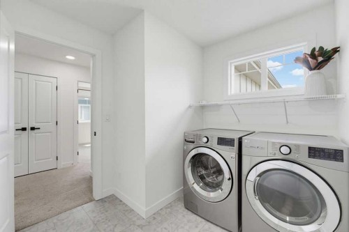 136 Sunrise Common, Cochrane, AB - Indoor Photo Showing Laundry Room