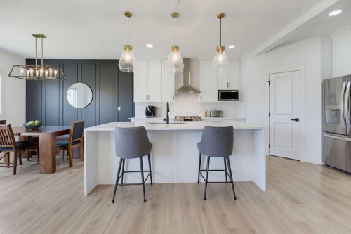 136 Sunrise Common, Cochrane, AB - Indoor Photo Showing Kitchen With Upgraded Kitchen