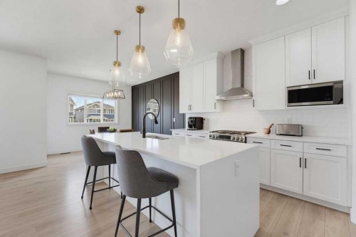 136 Sunrise Common, Cochrane, AB - Indoor Photo Showing Kitchen With Upgraded Kitchen