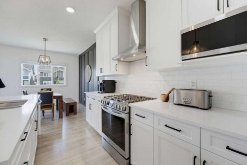 136 Sunrise Common, Cochrane, AB - Indoor Photo Showing Kitchen With Double Sink With Upgraded Kitchen