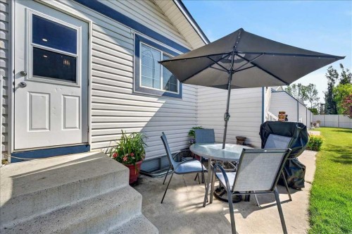 23-33 Stonegate Drive Nw, Airdrie, AB - Outdoor With Deck Patio Veranda With Exterior