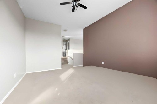 73 Sunset Heights, Cochrane, AB - Indoor Photo Showing Other Room