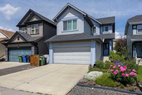 73 Sunset Heights, Cochrane, AB - Outdoor With Facade