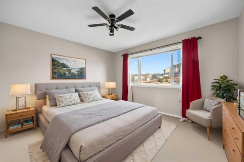 73 Sunset Heights, Cochrane, AB - Indoor Photo Showing Bedroom