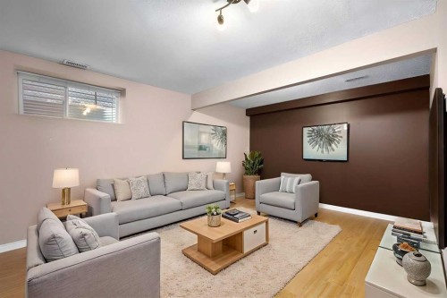 73 Sunset Heights, Cochrane, AB - Indoor Photo Showing Living Room
